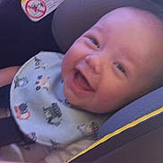 Westley joined the competition — help win amazing prizes! baby, smiling, car_seat, bib, child, infant, happy, seatbelt, face, clothing, cute, young, head, person, indoors, seat, safety, transportation, expression, joyful