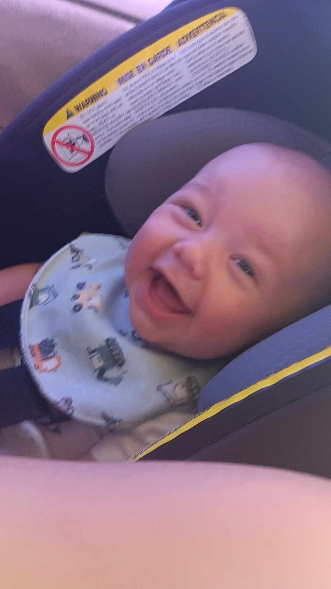 Westley joined the competition — help win amazing prizes! baby, smiling, car_seat, bib, child, infant, happy, seatbelt, face, clothing, cute, young, head, person, indoors, seat, safety, transportation, expression, joyful