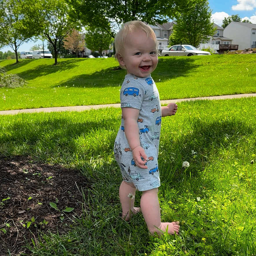 Karson is registered to the contest to win money with this photo: baby, backyard, face, field, grass, grassland, head, lawn, nature, outdoors, park, person, photography, plant, portrait, sky, summer, tree, vegetation, yard