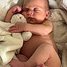 baby, newborn, sleeping, infant, stuffed_animal, blanket, soft, cozy, cute, resting, peaceful, skin, fingers, toes, diaper, bed, comfort, child, portrait, tender