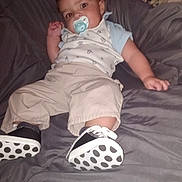 John joined the competition — help win amazing prizes! baby, blanket, casual, child, clothing, comfort, cute, footwear, gray, indoor, infant, pacifier, pants, person, polka_dot, reclining, resting, shirt, shoes, young_child