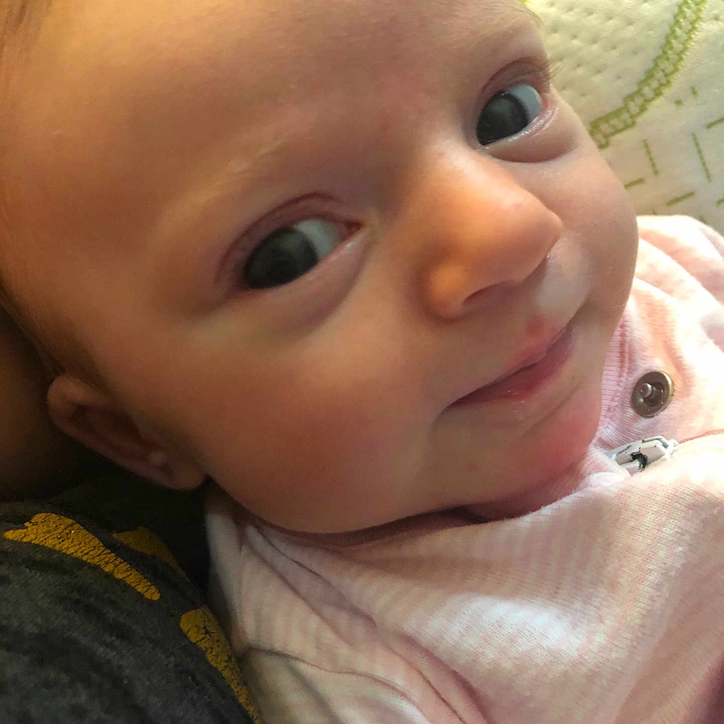 Amy is registered to the contest to win money with this photo: cheek, child, chin, close_up, ear, eye, eyebrow, eyelash, face, finger, forehead, hand, head, human_hair_color, infant, lip, mouth, neck, nose, skin