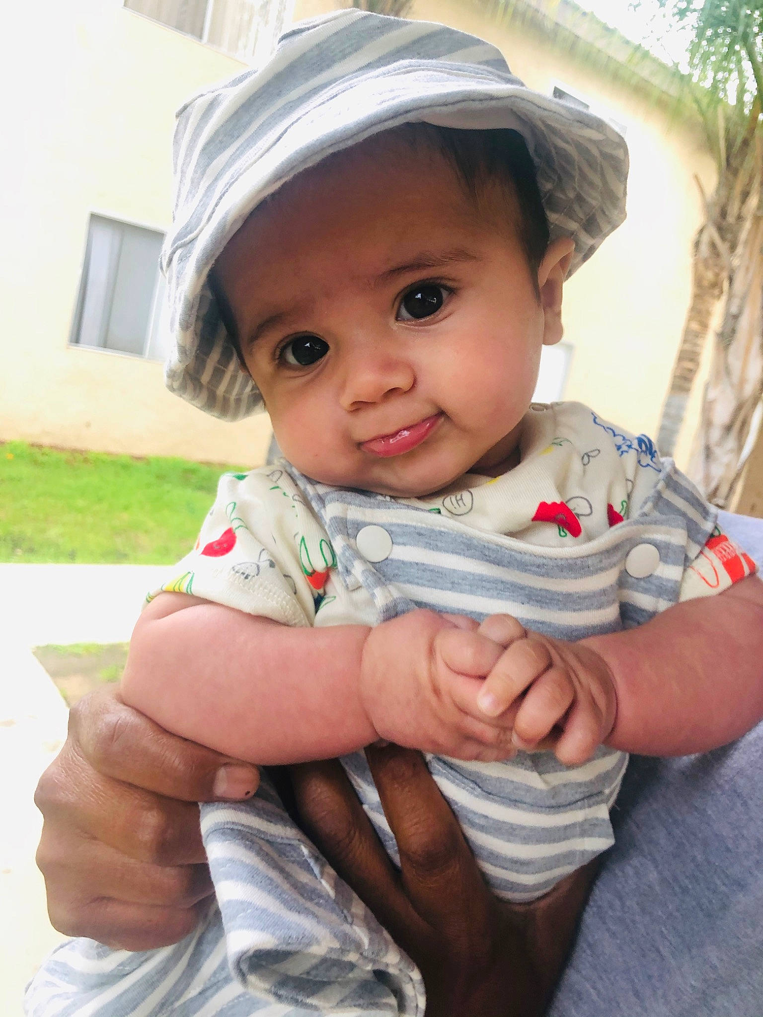 Jovanni joined the competition — help win amazing prizes! baby, baby_products, cheek, child, eye, hand, hat, headgear, headwear, person, product, sitting, skin, smile, sun_hat, toddler