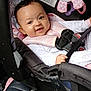 baby, car_seat, child, smiling, harness, plush_toy, seat_belt, infant, cute, car_interior, child_safety, pink, clothing, toy, happy, portrait, seat, person, young_child, baby_clothes