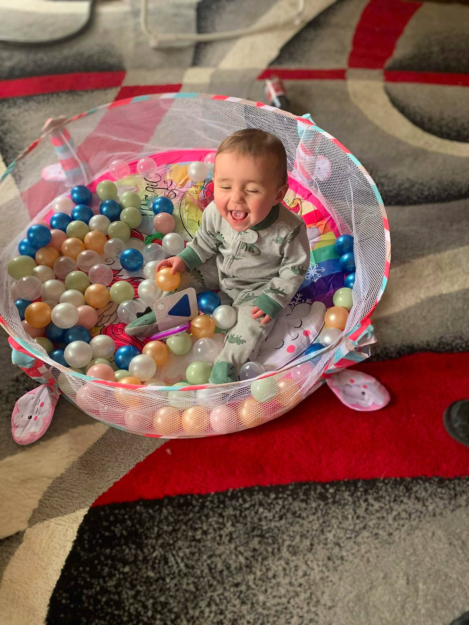 Kennadee joined the competition — help win amazing prizes! baby, baby_products, baby_toddler_clothing, baby_toys, ball, child, circle, comfort, event, flooring, fun, grass, leisure, person, play, recreation, sitting, smile, toddler, toy