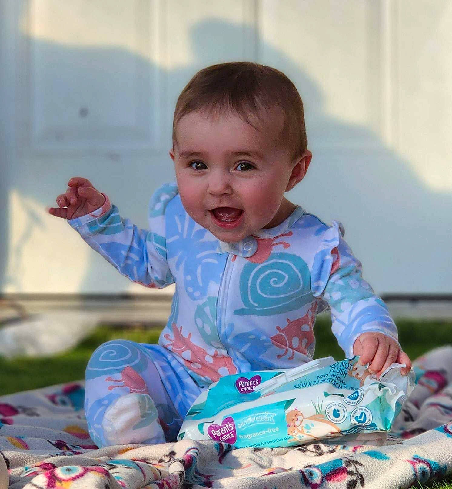 Kennadee joined the competition — help win amazing prizes! baby, baby_toddler_clothing, beauty, cheek, child, event, facial_expression, fun, grass, happy, holiday, leisure, pattern, people, person, play, sitting, skin, sleeve, smile