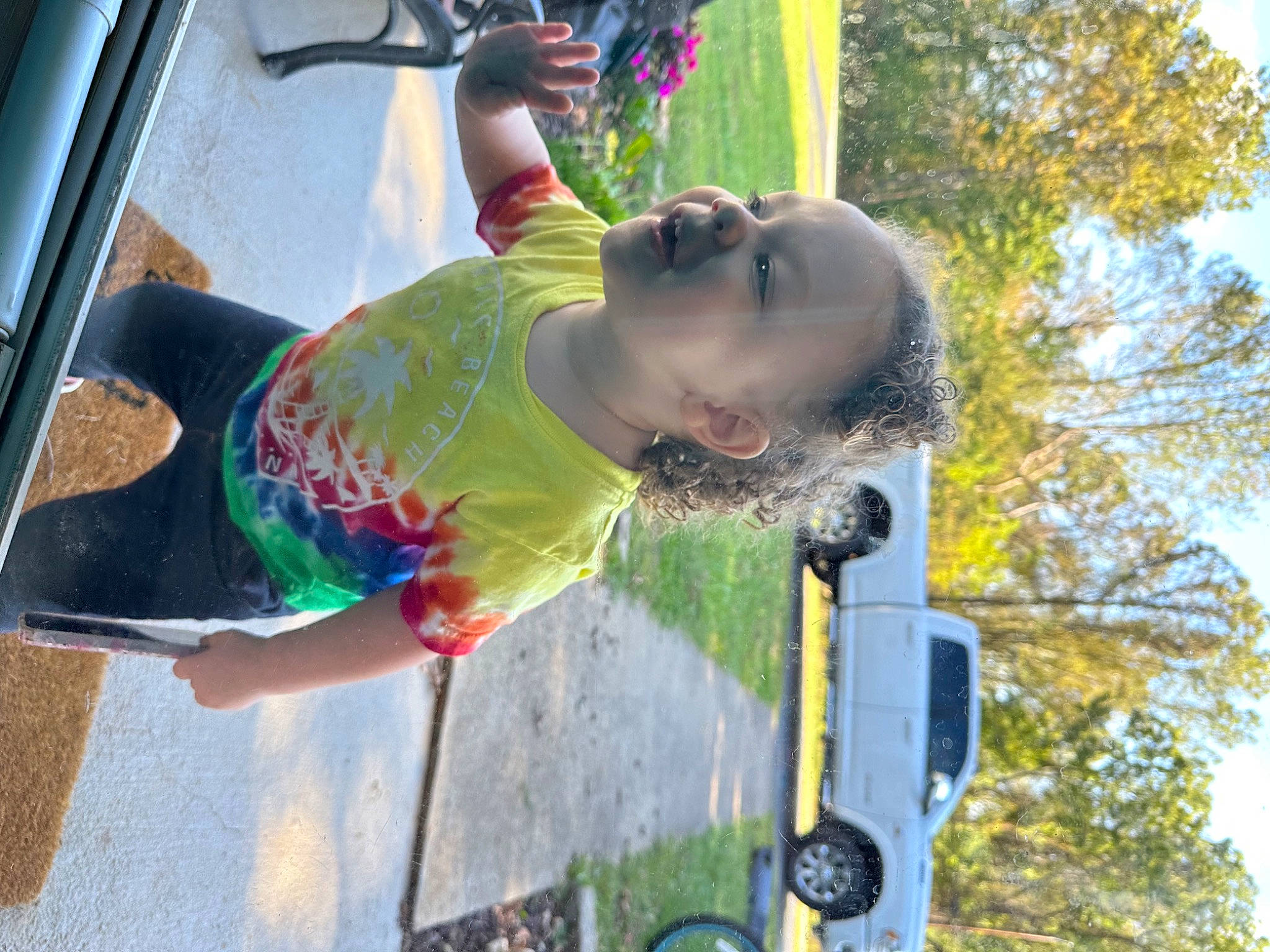 Tariah is registered to the contest to win money with this photo: auto_part, automotive_exterior, car, child, city, fun, grass, happy, leisure, motor_vehicle, person, plant, recreation, sky, smile, sunglasses, tire, toddler, tree, vehicle_door