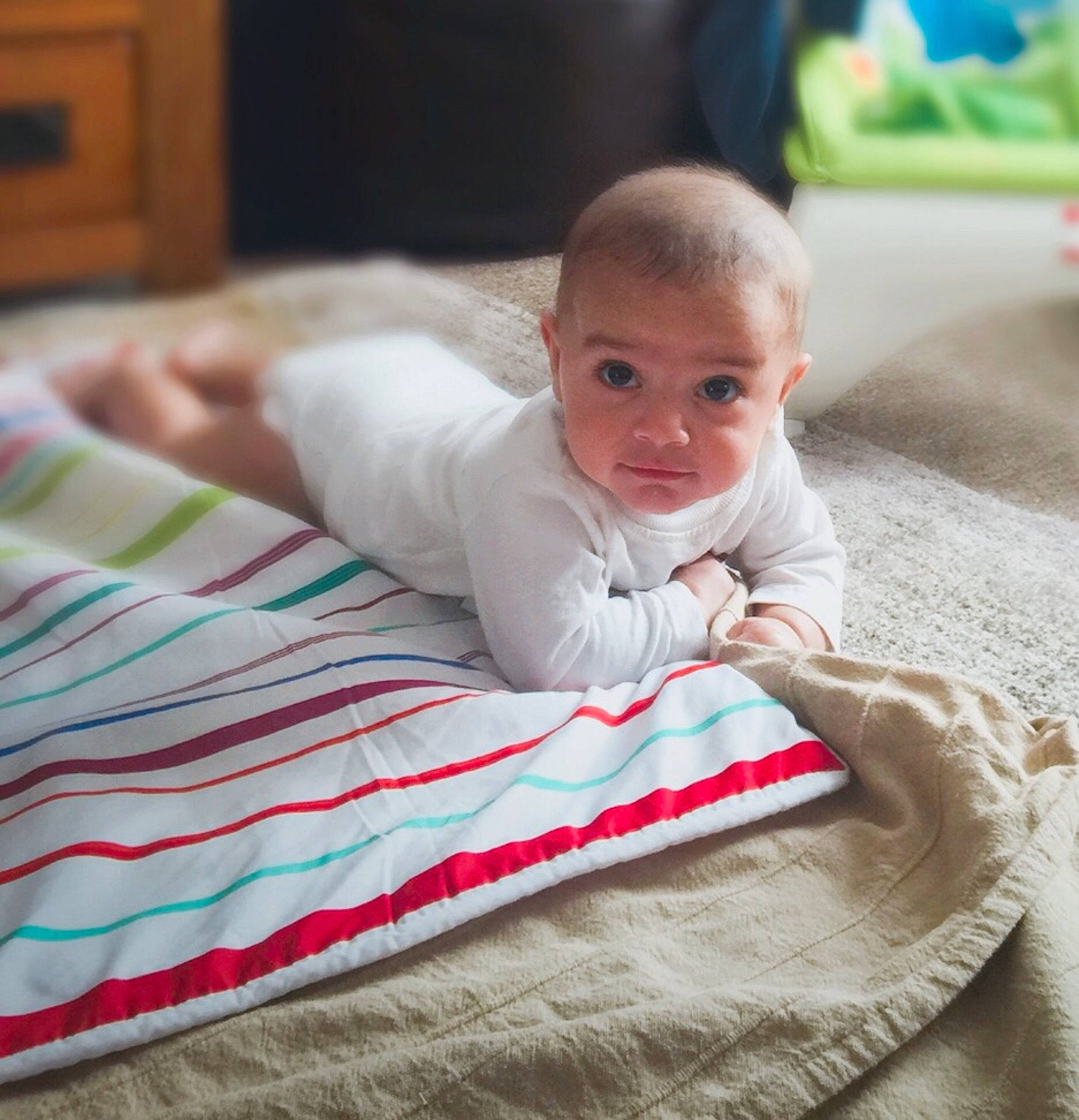Hassan joined the competition — help win amazing prizes! baby_products, bed, bedtime, blanket, boy, child, day, infant, material, person, play, product, sitting, textile, toddler