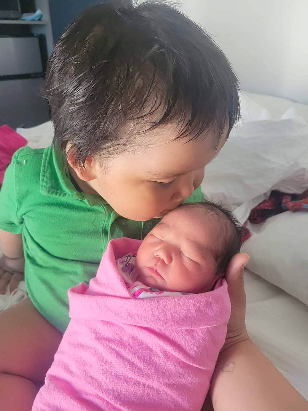 Everson Victor joined the competition — help win amazing prizes! abdomen, baby, cheek, child, comfort, facial_expression, finger, gesture, hair, happy, mouth, neck, nose, person, room, shoulder, sitting, skin, t_shirt, toddler