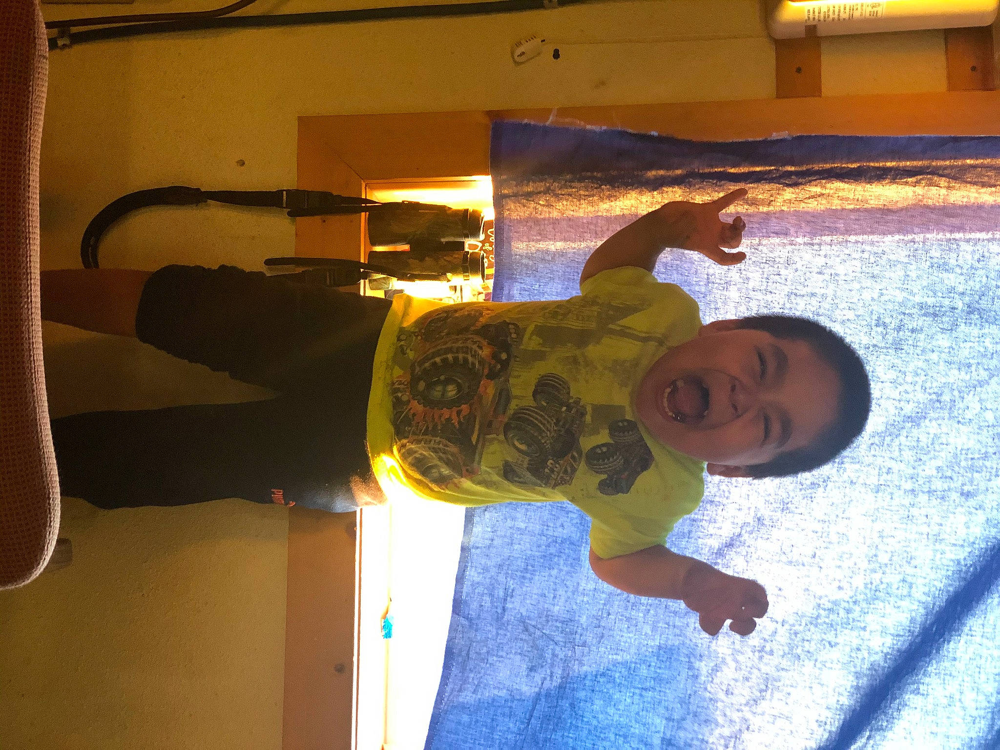 Isaiah is registered to the contest to win money with this photo: ceiling, elbow, fun, happy, leisure, person, room, shadow, smile, tints_and_shades, wood, world, wrist