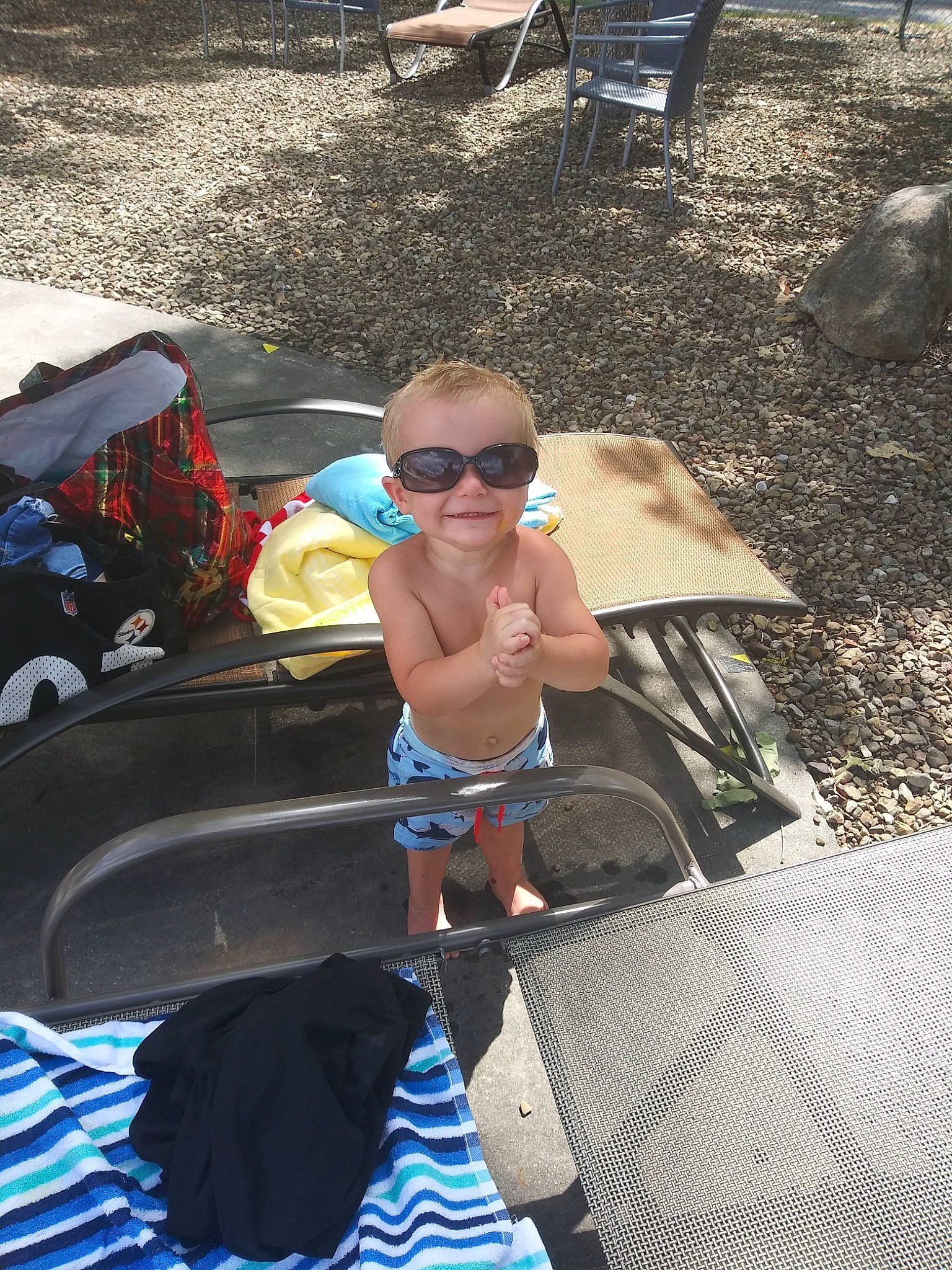 Johnny joined the competition — help win amazing prizes! automotive_exterior, barechested, blue, eyewear, fun, glasses, goggles, grass, joy, leisure, light, outdoor_furniture, person, recreation, shade, shorts, smile, sunglasses, swimwear, thigh