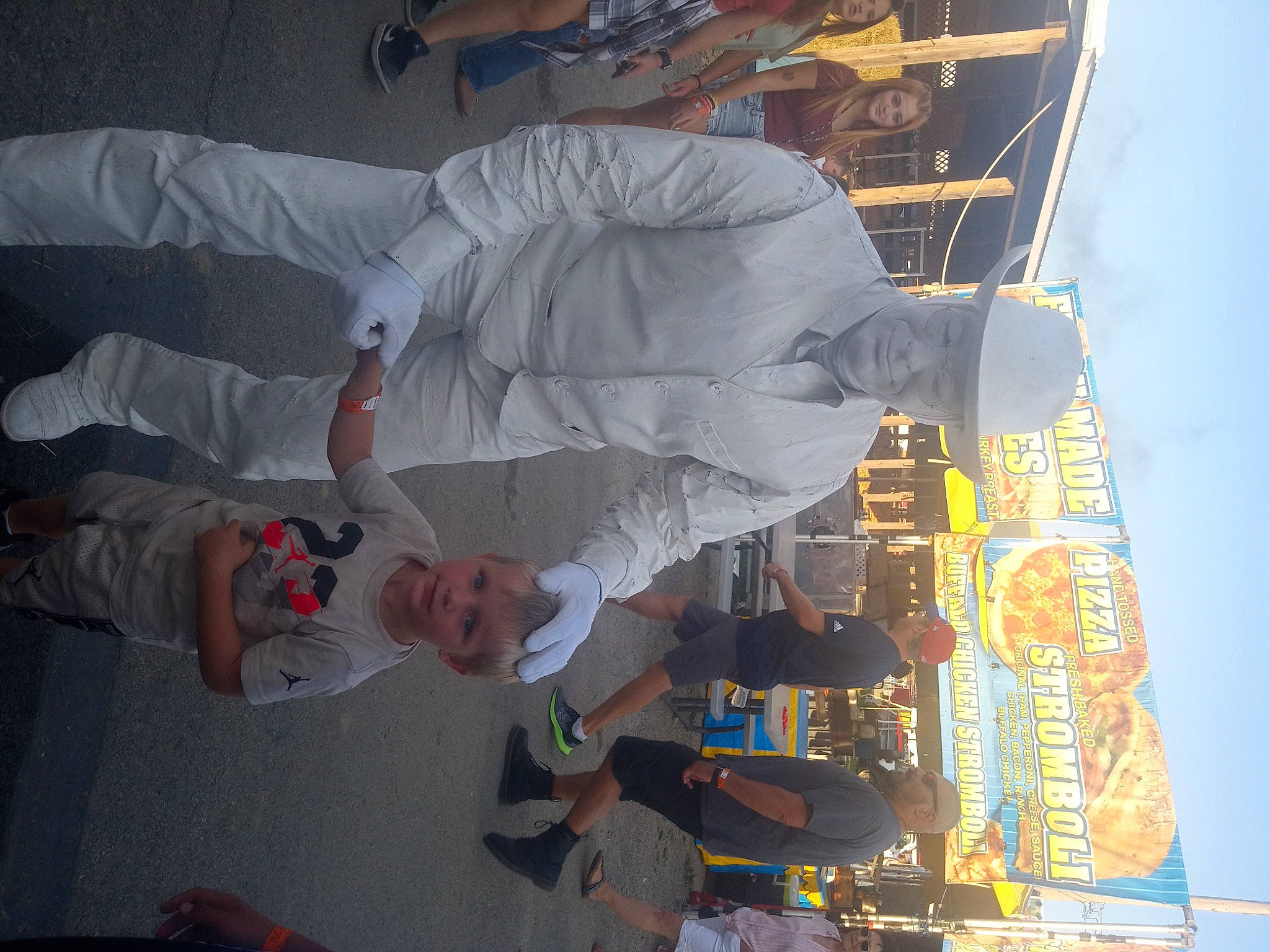 Johnny joined the competition — help win amazing prizes! art, city, engineering, fun, headwear, person, sky, space, t_shirt, travel, urban_design, white, world