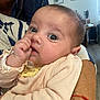 Camélia a rejoint le concours — aidez-le/la à gagner de superbes lots ! adult_arm, baby, background, child, close_up, curious, eyes, face, furniture, holding, home, indoor, infant, pacifier, person, portrait, skin, striped_clothing, thumb_sucking, warm