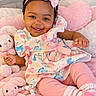 Brooklyne joined the competition — help win amazing prizes! baby, smiling, infant, pink, headband, dress, plush_toy, stuffed_animal, pacifier, cushion, bed, cute, child, happy, indoors, soft_toys, dinosaur_print, leggings, toddler, cozy