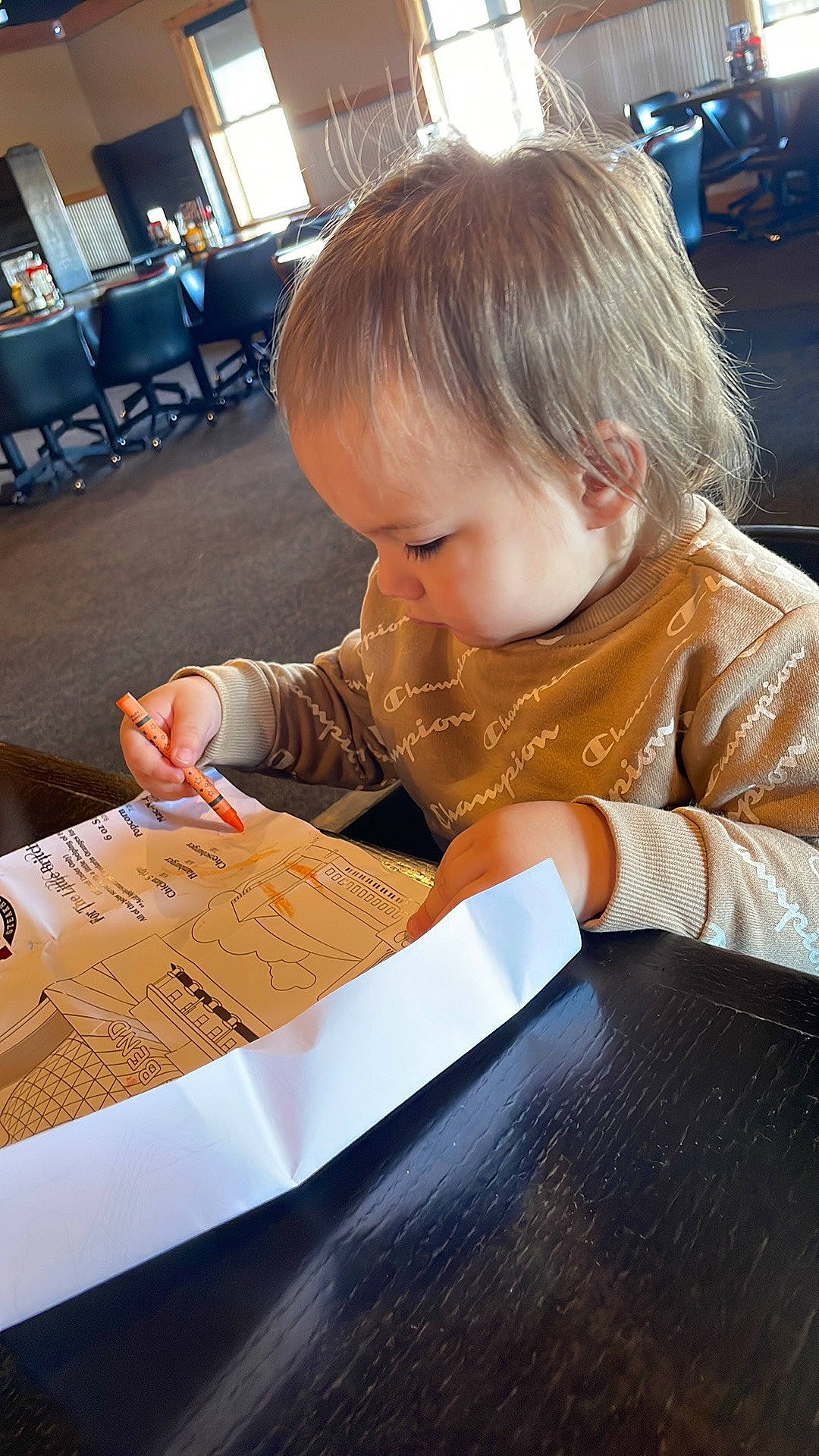 Kenzo joined the competition — help win amazing prizes! baby, chair, child, curious, flooring, font, fun, hardwood, learning, office_instrument, paper_product, person, play, reading, room, sitting, table, toddler, wood, writing