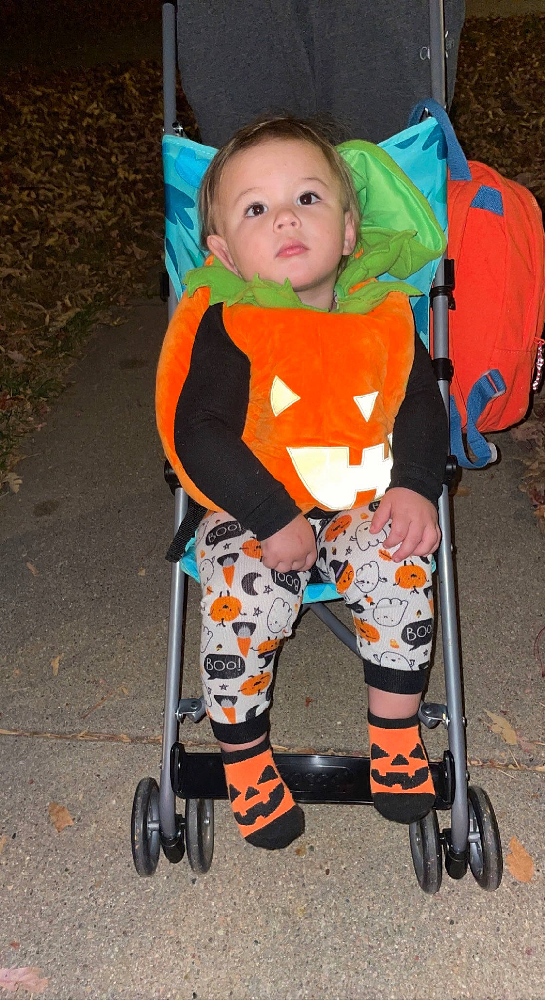 Kenzo is registered to the contest to win money with this photo: baby, baby_carriage, baby_products, baby_toddler_clothing, child, costume, electric_blue, fashion_accessory, fun, human_leg, knee, orange, person, personal_protective_equipment, play, sitting, sleeve, t_shirt, toddler, trick_or_treat