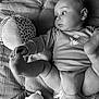 Léon a rejoint le concours — aidez-le/la à gagner de superbes lots ! baby, ball, blanket, child, clothing, curious, cute, face, foot, hand, indoor, infant, laying_down, monochrome, onesie, plush_toy, portrait, soft_toys, texture, young