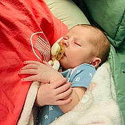 Willow joined the competition — help win amazing prizes! baby, sleeping, pacifier, blanket, person, hand, cushion, clothing, infant, comfort, cozy, rest, child, nap, cute, soft, indoor, peaceful, face, closeup