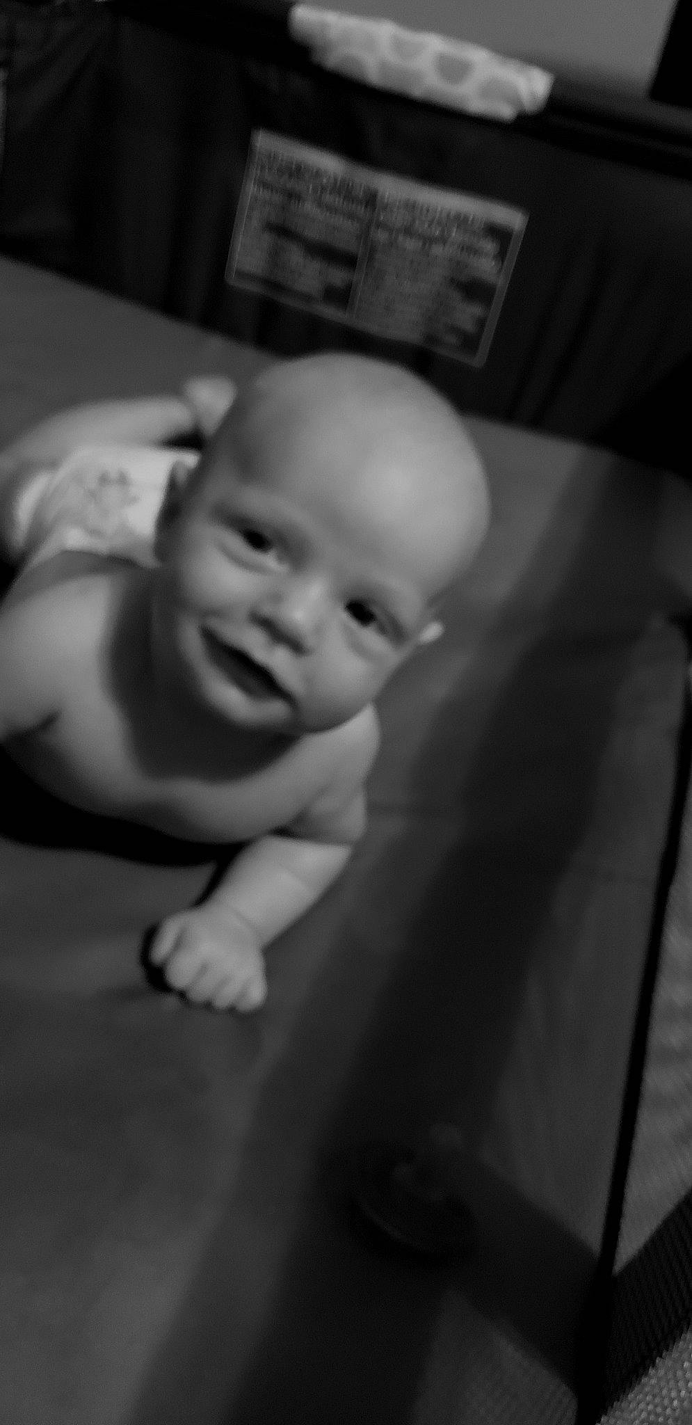 Eli is registered to the contest to win money with this photo: baby, black, black_and_white, cheek, child, eye, face, facial_expression, head, lip, monochrome, monochrome_photography, mouth, nose, person, photograph, photography, skin, smile, toddler