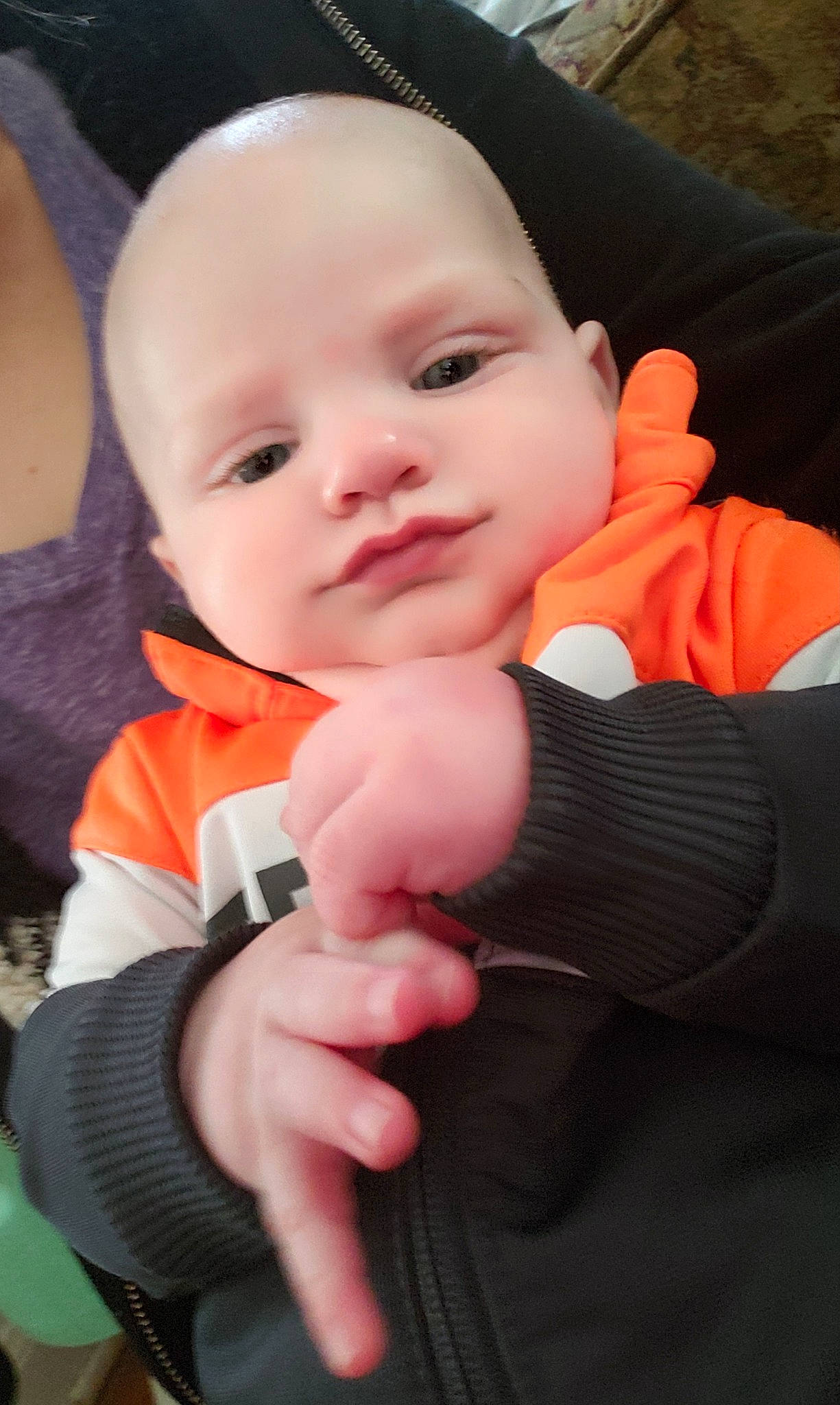 Eli is registered to the contest to win money with this photo: baby, beauty, cheek, child, eye, face, finger, gesture, hand, head, lip, mouth, nose, person, skin, smile, thumb, toddler