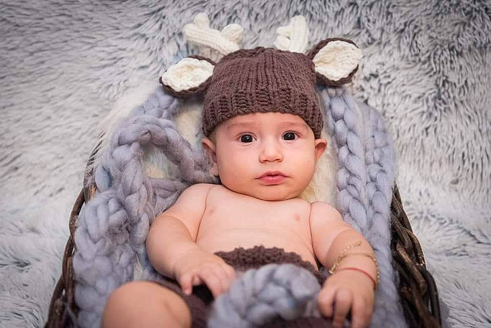 Denis joined the competition — help win amazing prizes! baby, baby_toddler_clothing, beanie, cap, child, costume_hat, eye, eyelash, fashion_accessory, fawn, grass, head, headband, headpiece, headwear, knit_cap, person, stuffed_toy, toddler, wood