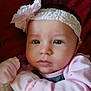 Kenzie Lynn joined the competition — help win amazing prizes! adorable, baby, bow, calm, child, close-up, cute, expression, eyes, face, headband, indoor, infant, newborn, pink_clothing, portrait, resting, skin, soft_fabric, tender