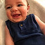 baby, blanket, blue_clothing, cheeks, child, closeup, comfort, cute, expression, face, happy, head, indoors, infant, person, portrait, skin, sleeveless, smiling, young