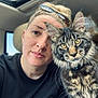 Maksim joined the competition — help win amazing prizes! animal, black_shirt, blond_hair, car, cat, closeup, companion, face, friendship, fur, glasses, indoor, person, pet, seat, selfie, tabby_cat, whiskers, window, yellow_eyes
