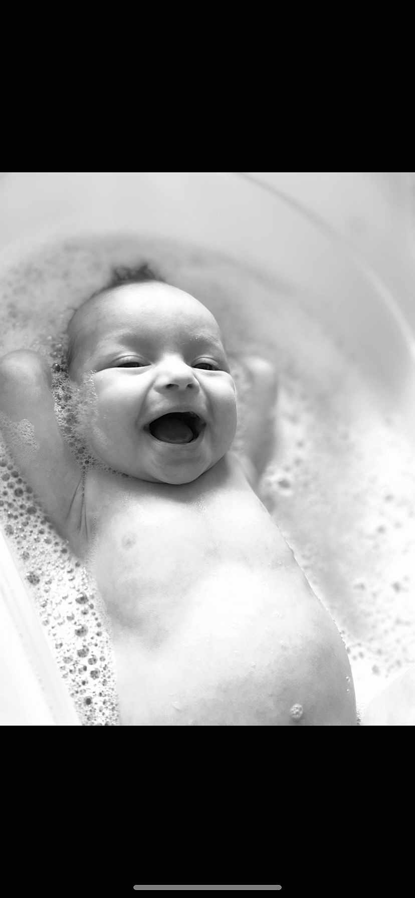 Aria joined the competition — help win amazing prizes! baby, bath, bubbles, smiling, infant, water, foam, tub, happy, child, skin, head, arms, cute, closeup, washing, relaxing, black_and_white, portrait, young