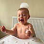 baby, child, foam, bubbles, high_chair, happy, laughing, soap, skin, head, hand, table, indoor, playful, water, messy, cute, joyful, smiling, infant
