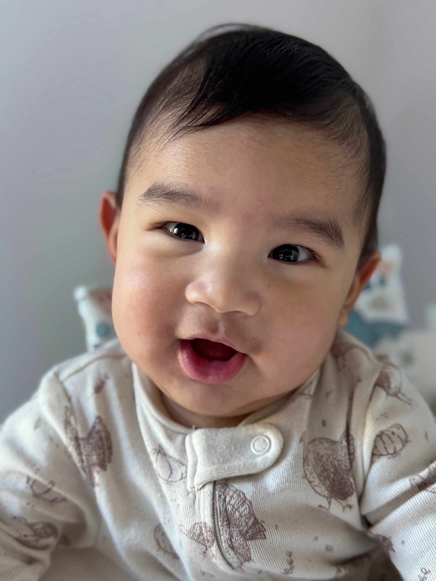 Shai joined the competition — help win amazing prizes! baby, infant, child, face, smile, onesie, clothing, cute, portrait, indoors, closeup, happy, young, person, skin, head, eyes, mouth, hair, expression