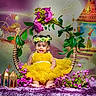 baby, child, colorful, cute, decorative, fairy_tale_background, festive, floral_hoop, flower_crown, happy, indoor, infant, lanterns, pink_flowers, playful, portrait, purple_rug, sitting, smiling, yellow_dress