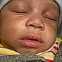 Daniel is registered to the contest to win money with this photo: baby, sleeping, hat, face, closeup, child, infant, blanket, clothing, peaceful, mouth, nose, eyelids, skin, portrait, cute, young, resting, warm, comfort