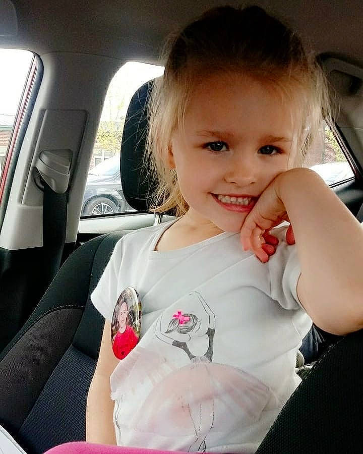 Talayah is registered to the contest to win money with this photo: auto_part, baby, beauty, car, car_seat, cheek, child, cool, driving, finger, hand, joy, nose, person, pink, seat_belt, skin, smile, technology, toddler