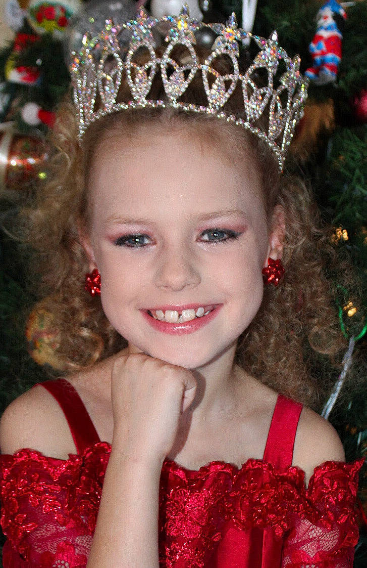 Izabell joined the competition — help win amazing prizes! chin, christmas_decoration, christmas_ornament, eyebrow, face, facial_expression, fashion, fawn, flash_photography, fun, hair, hairstyle, happy, head, headpiece, joy, makeover, person, pink, red