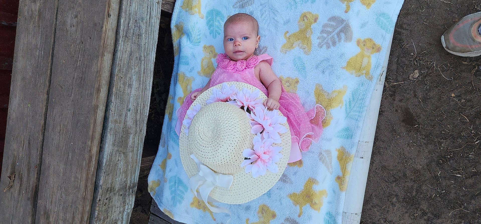 Nova is registered to the contest to win money with this photo: applique, baby, bed, blanket, bonnet, clothing, dress, face, footwear, furniture, hat, head, pattern, person, photography, portrait, quilt, shoe, sunhat, toy