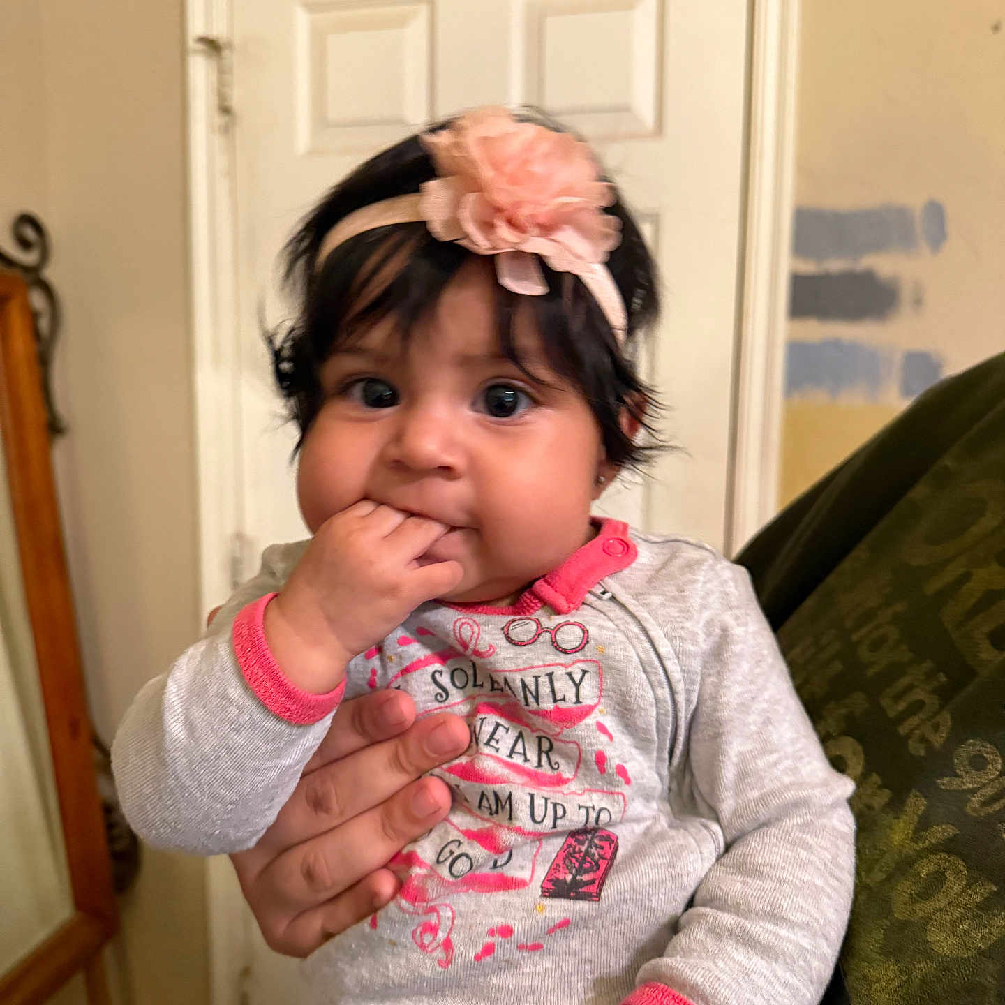 Ellie joined the competition — help win amazing prizes! baby, bodypart, clothing, couch, face, finger, furniture, hand, happy, hardwood, head, knitwear, longsleeve, person, photography, portrait, sleeve, smile, sweater, wood