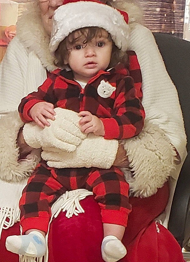 Noah is registered to the contest to win money with this photo: baby, baby_toddler_clothing, christmas, comfort, event, fictional_character, fur, fur_clothing, happy, head, headwear, holiday, human_body, lap, person, red, santa_claus, sleeve, toddler, tree