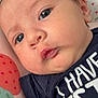 Elise joined the competition — help win amazing prizes! baby, closeup, face, infant, cute, child, apparel, text, cushion, pattern, strawberry, heart, skin, eyes, mouth, clothing, portrait, soft, laying, young