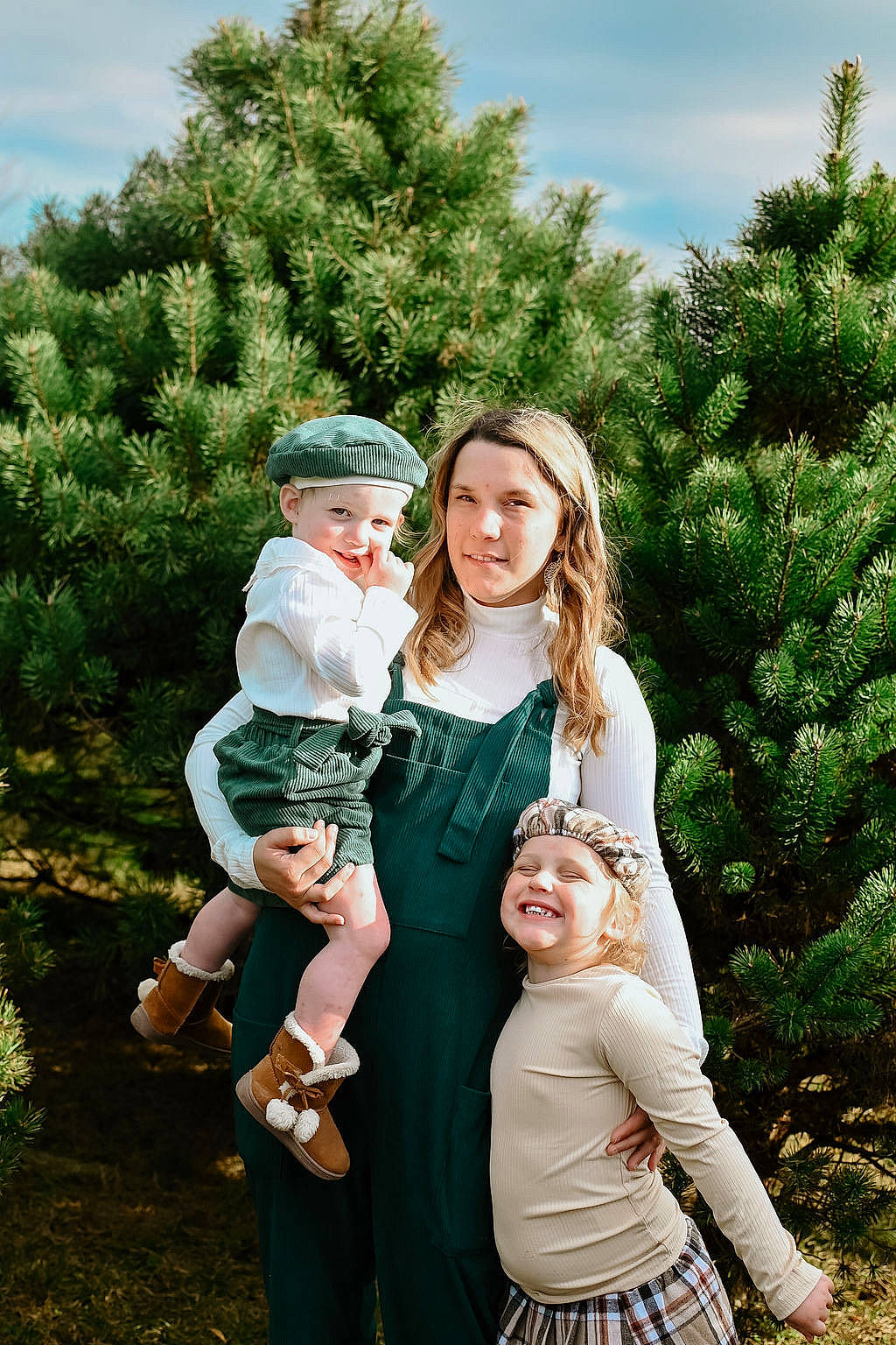 Natalie is registered to the contest to win money with this photo: baby, botany, child, conifer, event, evergreen, fun, gesture, grass, happy, hat, headwear, joy, leaf, nature, people_in_nature, person, plant, sky, smile