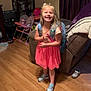 Everly is registered to the contest to win money with this photo: architecture, building, child, clothing, couch, face, female, footwear, furniture, hardwood, head, indoors, livingroom, person, photography, portrait, room, shoe, shorts, wood