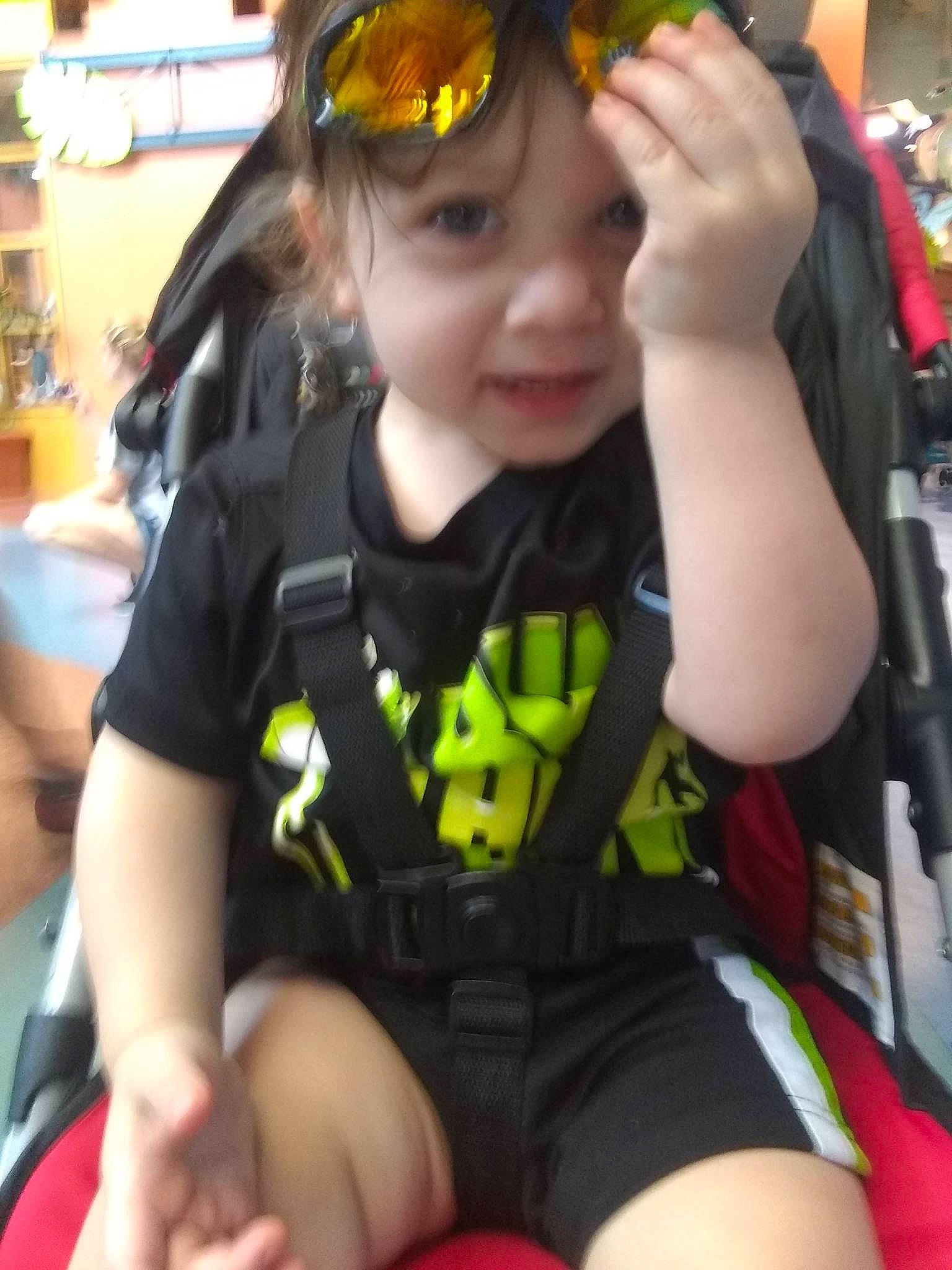 Sebastian is registered to the contest to win money with this photo: baby_products, black_hair, child, finger, leg, person, personal_protective_equipment, play, product, thigh, thumb, toddler