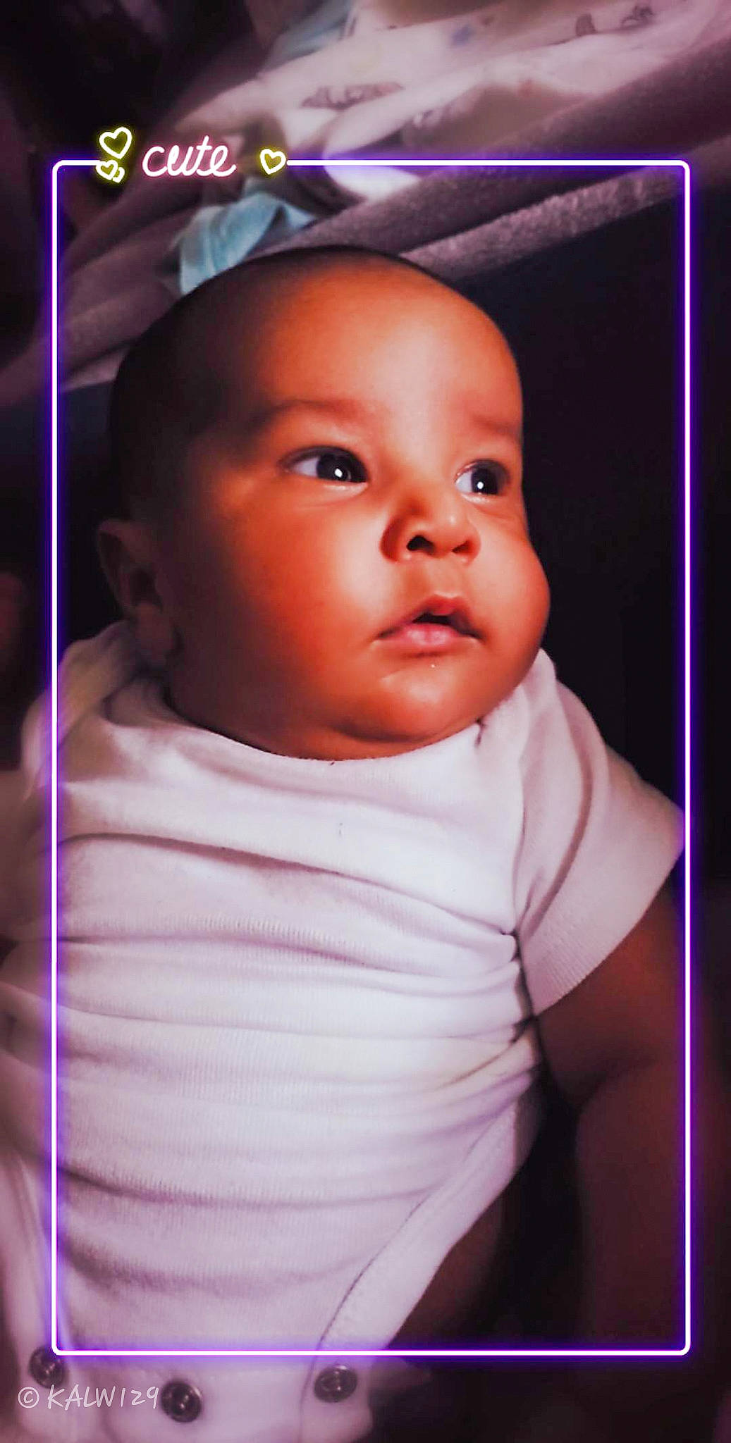 Kellen is registered to the contest to win money with this photo: baby, beauty, cheek, child, chin, eye, eyebrow, face, forehead, fun, head, iris, lip, mouth, nose, person, pink, purple, skin, smile