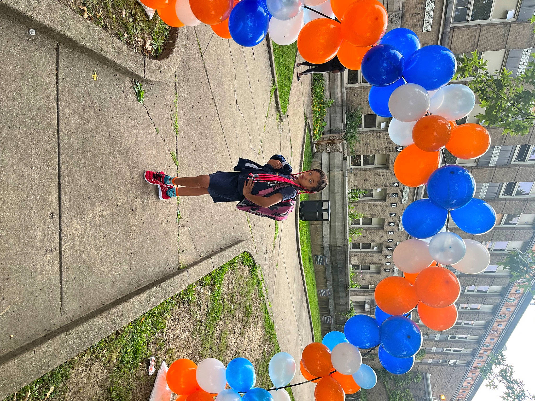 Moon is registered to the contest to win money with this photo: azure, balloon, biome, blue, daytime, design, electric_blue, event, fun, leisure, light, line, nature, party_supply, person, photograph, red, snapshot, urban_design, white