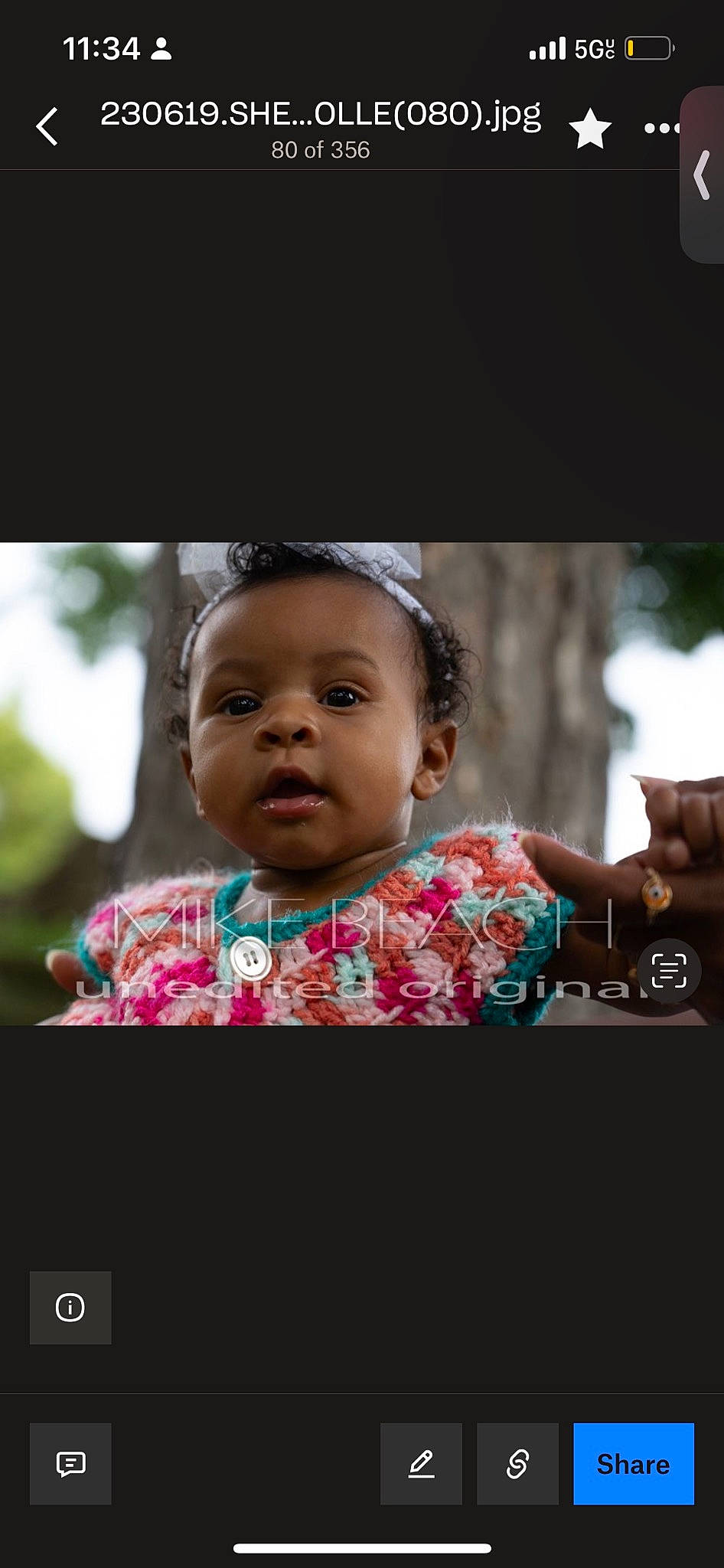 Këigo is registered to the contest to win money with this photo: baby, cheek, child, communication_device, eyelash, flash_photography, fun, gadget, gesture, happy, iris, leisure, magenta, nose, person, portrait, portrait_photography, sitting, skin, smile