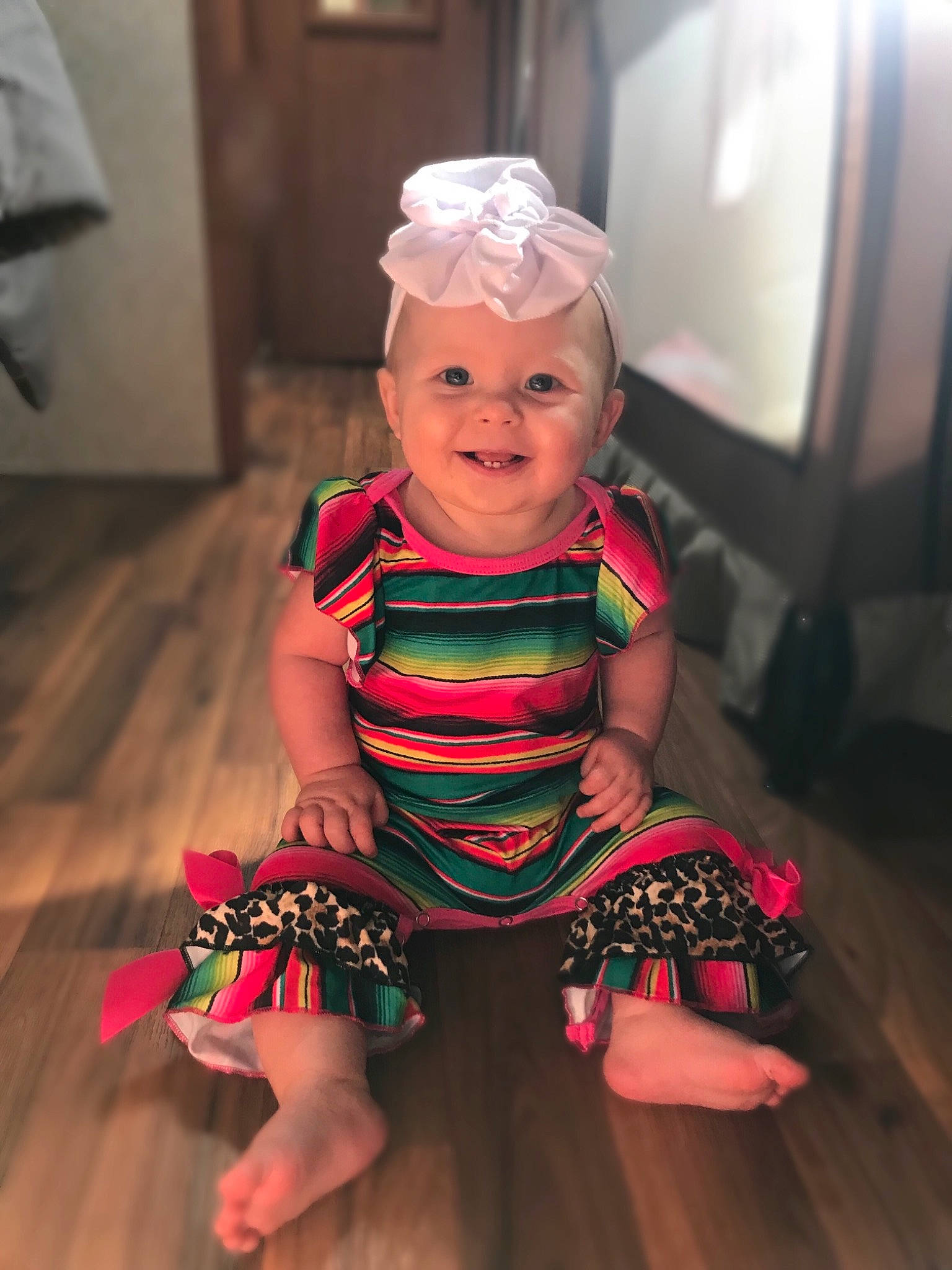 Riverlyn is registered to the contest to win money with this photo: baby, baby_toddler_clothing, cheek, child, clothing, costume, dress, fashion_accessory, hair_accessory, head, headband, headgear, headpiece, iris, joy, person, pink, play, sitting, skin