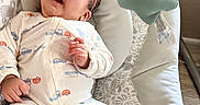 Raul Bernal Jr. joined the competition — help win amazing prizes! baby, sunglasses, infant, baby_seat, onesie, toy, star, mobile, cute, child, relaxed, indoors, sleepwear, patterned_clothing, small_hands, floor, plush, comfort, head_support, expression