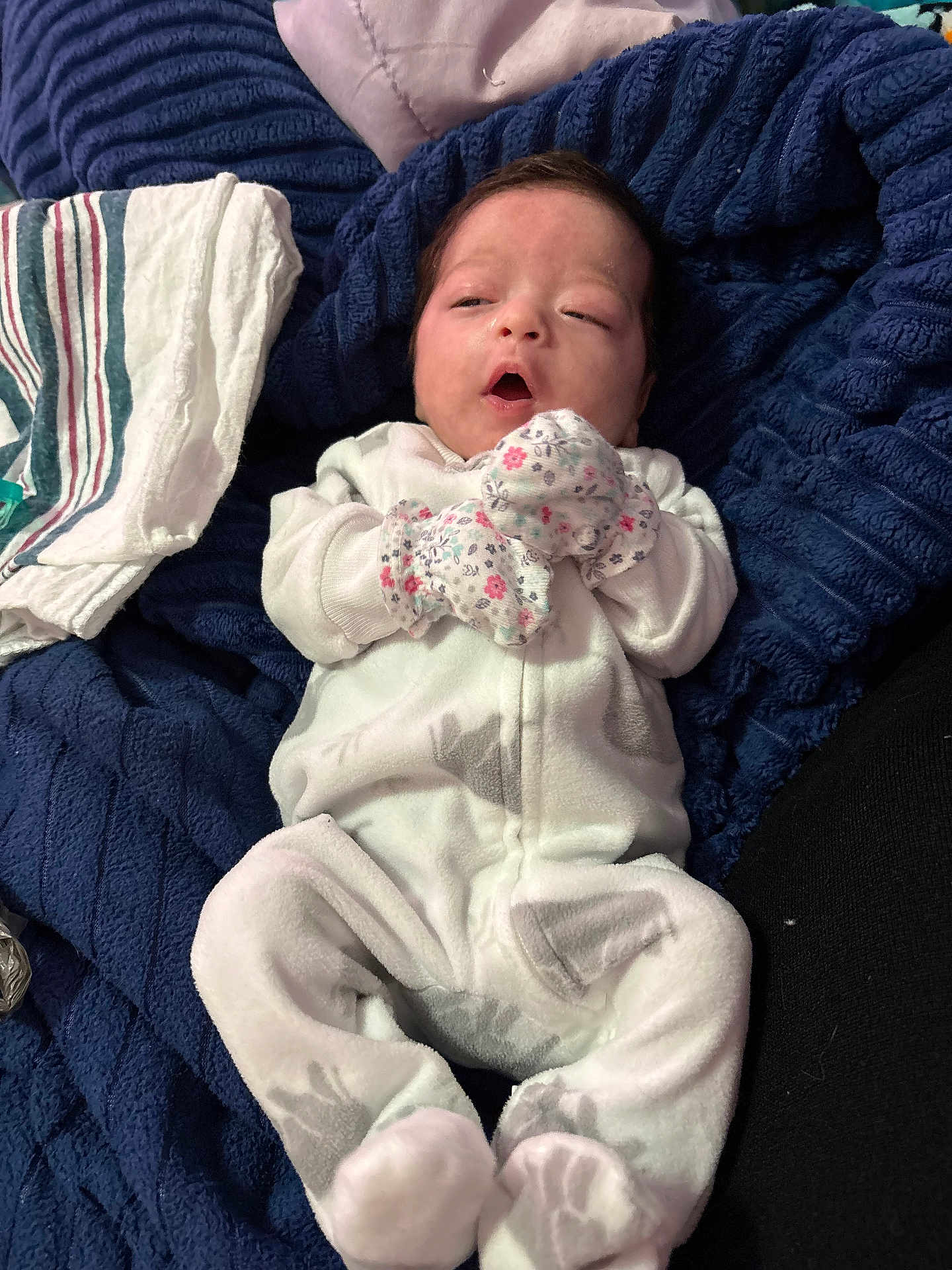 Sawyer joined the competition — help win amazing prizes! newborn, baby, infant, onesie, mittens, blanket, sleepy, lying_down, soft_fabric, plush, cozy, indoor, child, cute, face, person, clothing, resting, home, comfort
