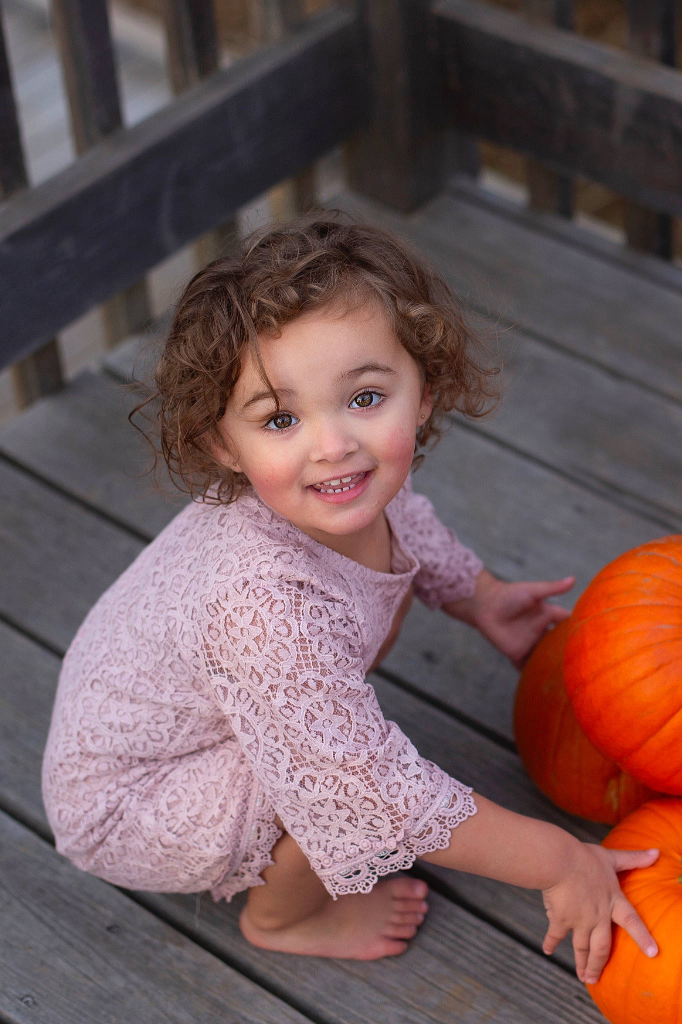 Vienna is registered to the contest to win money with this photo: calabaza, dress, eye, facial_expression, flash_photography, flooring, fun, gourd, hair, happy, head, iris, joy, organ, person, plant, pumpkin, smile, squash, toddler