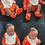 baby, infant, halloween, orange_clothing, bib, socks, pumpkin, ghost, couch, indoor, child, cute, expression, multiple_poses, knitted_socks, holiday, festive, seated, person, portrait